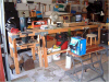Main bench, bandsaw on left, Black-&-Decker engine stand on right:^)